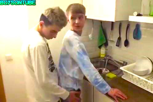 Boyfriends at home in kitchen